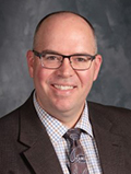 a picture of Dr RYAN Saunders who is the superintendent of the Springfield Platteview community school District