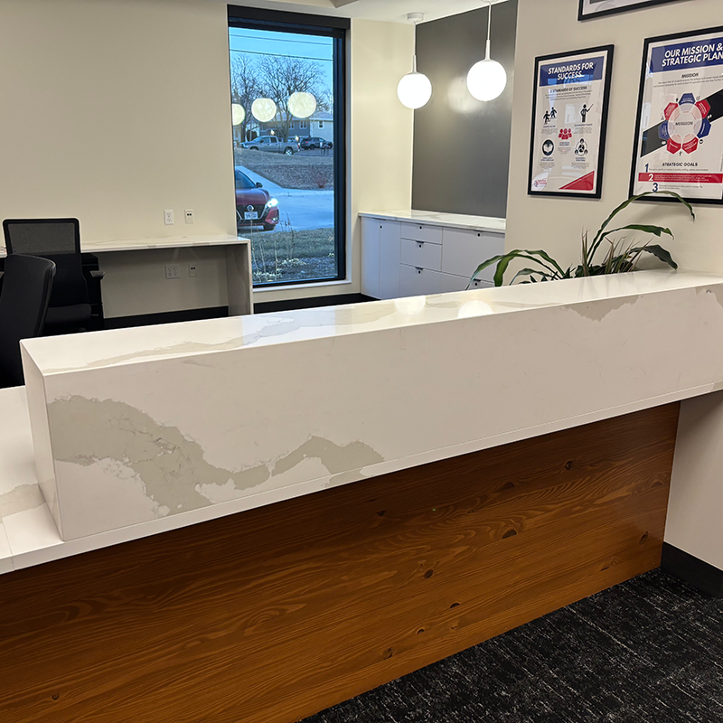 front desk area with wood on bottom